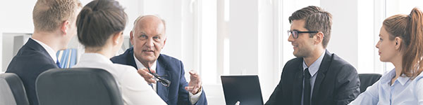 Business man leading a conference with colleagues