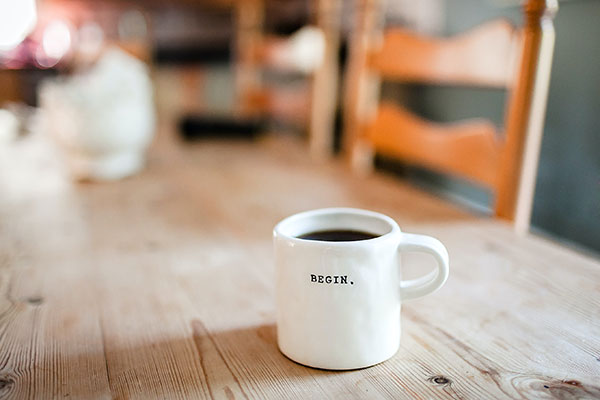 coffee mug that says begin